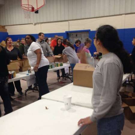 Volunteers waiting to fill their boxes.