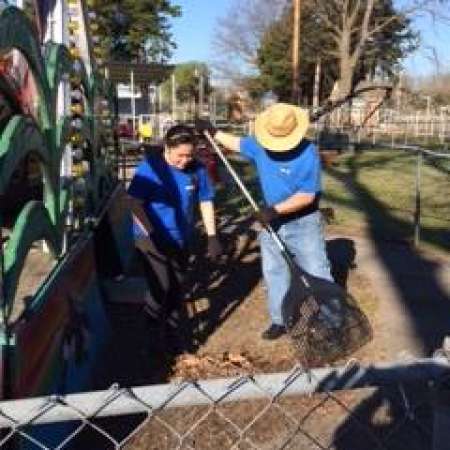 Students, parents, and mentors help to clean up Kiddie Park.